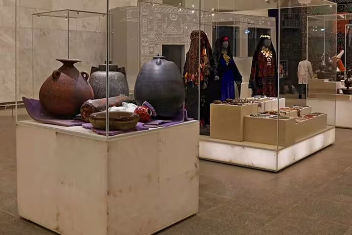 National Museum gallery with ancient pottery and traditional costumes, part of citadel and bazaars tour