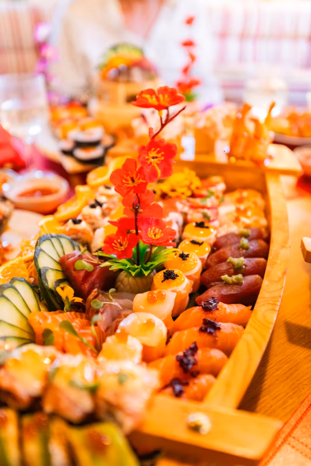 Beautifully arranged Sushi Aniki show cooking wooden boat platter served during Naunet Especial sunset cruise