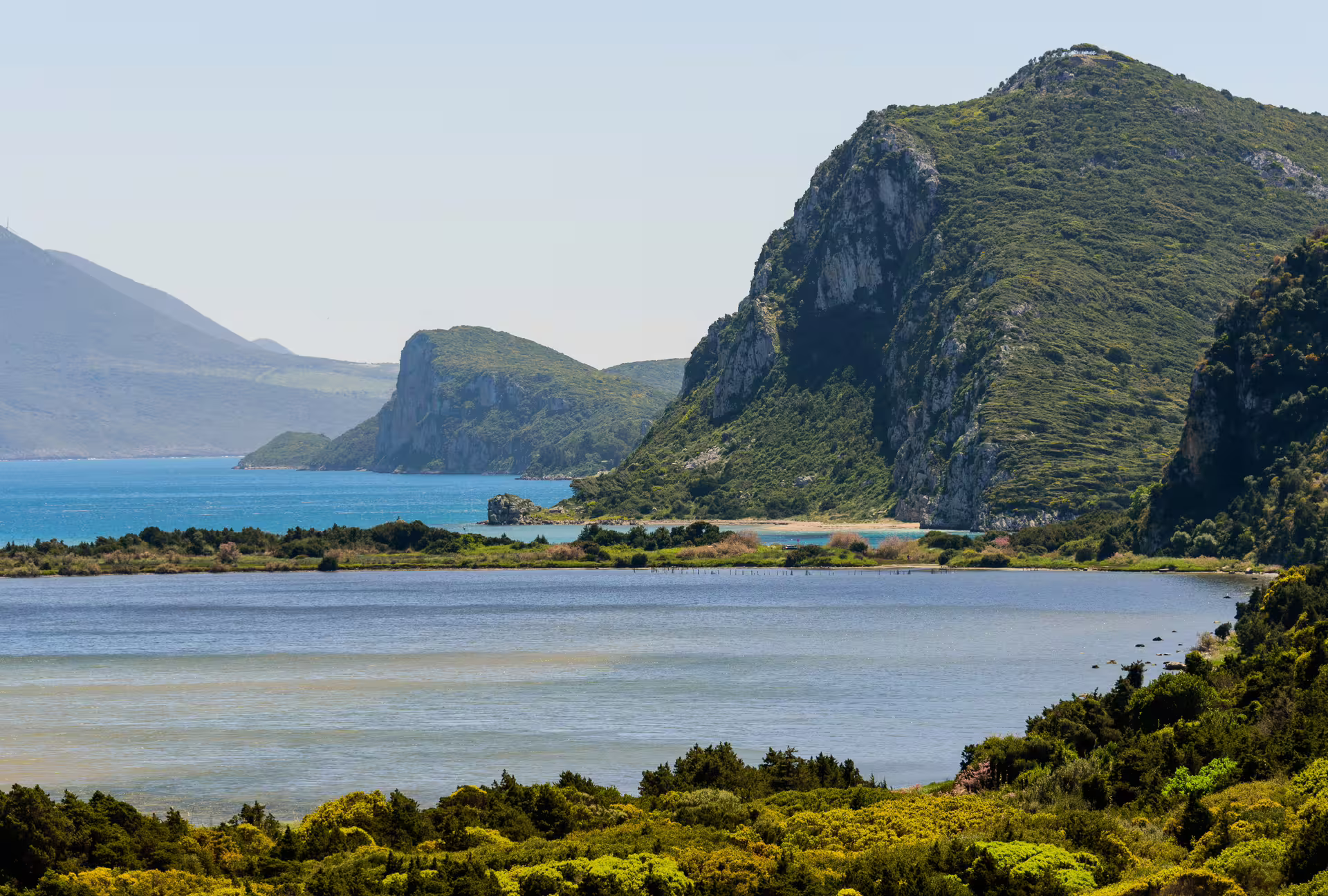 Panoramic view of Navarino Bay cliffs and lagoon wetlands in Pylos, scenic stop on the guided hiking tour