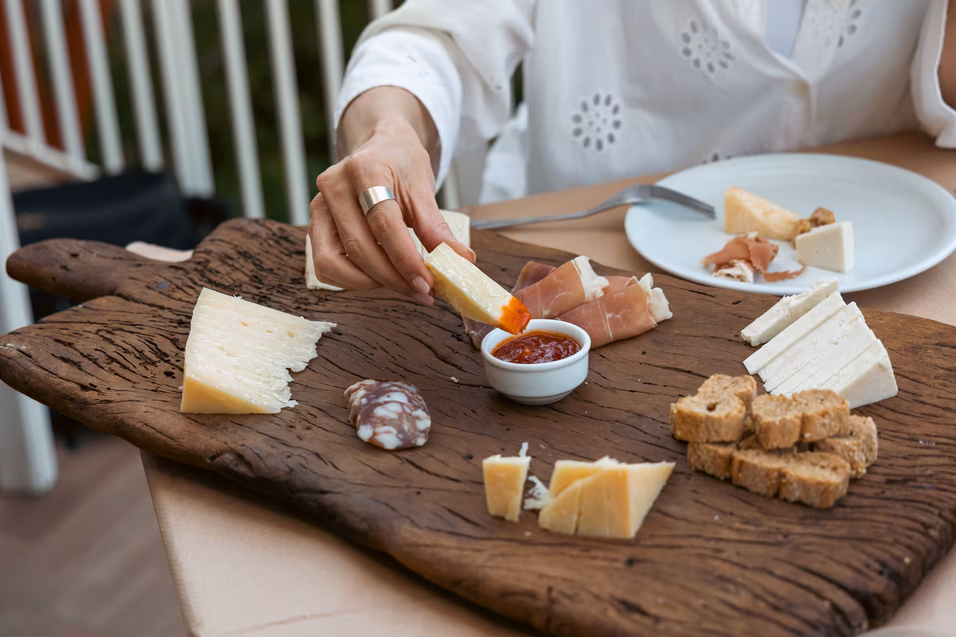 Tasting Naxos cheeses and cured meats with local jam, authentic foodie stop on village tour in Greece