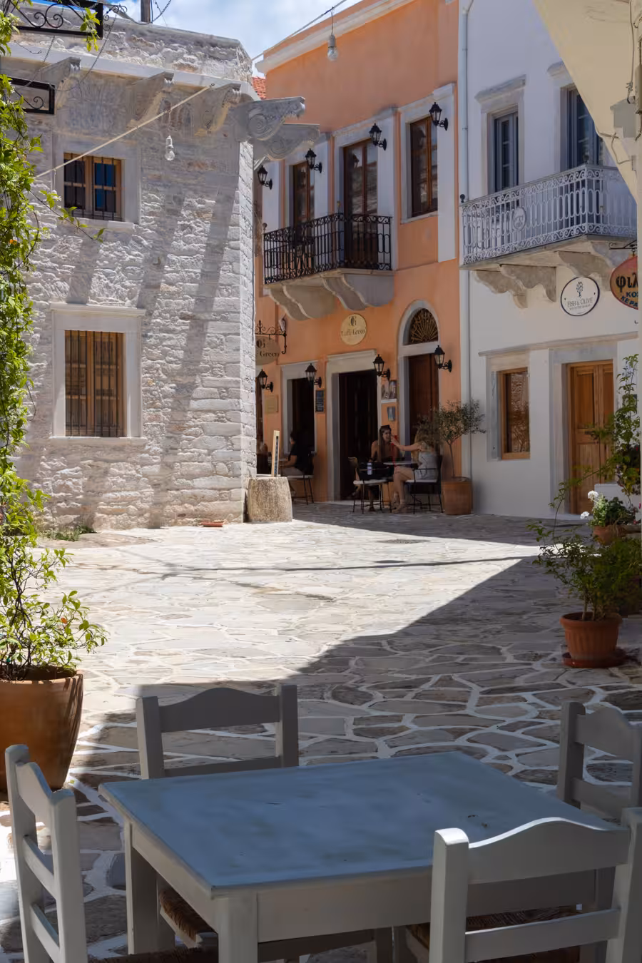 Traditional Naxos village square with stone alleys and café, stop on Foodie’s Favourites Village Tour Greece