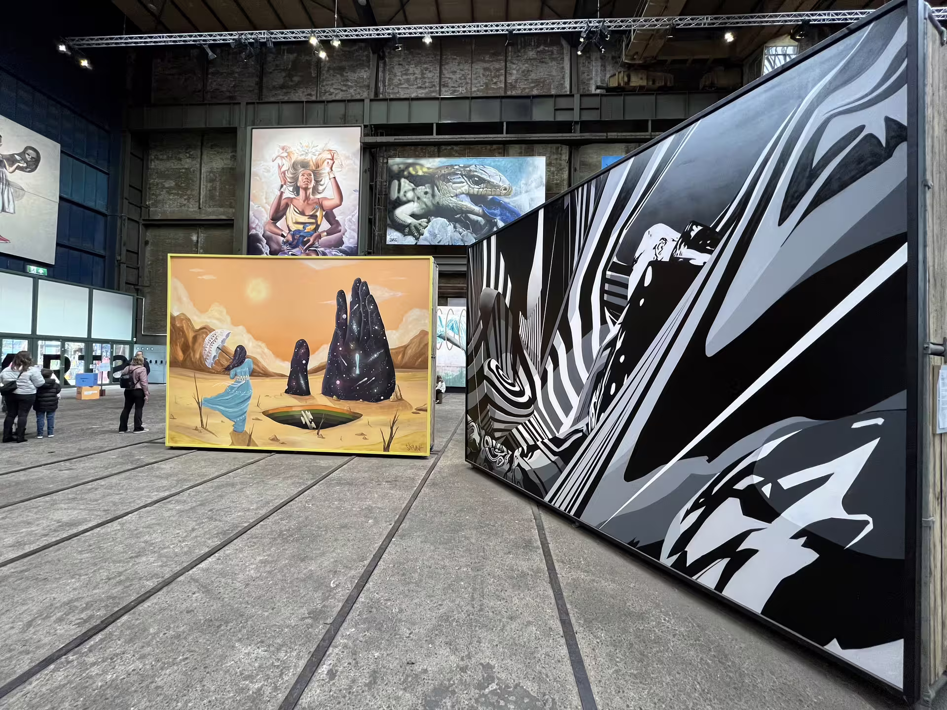 Vibrant street art murals at NDSM Amsterdam showcasing diverse styles, featured in a captivating private tour experience.