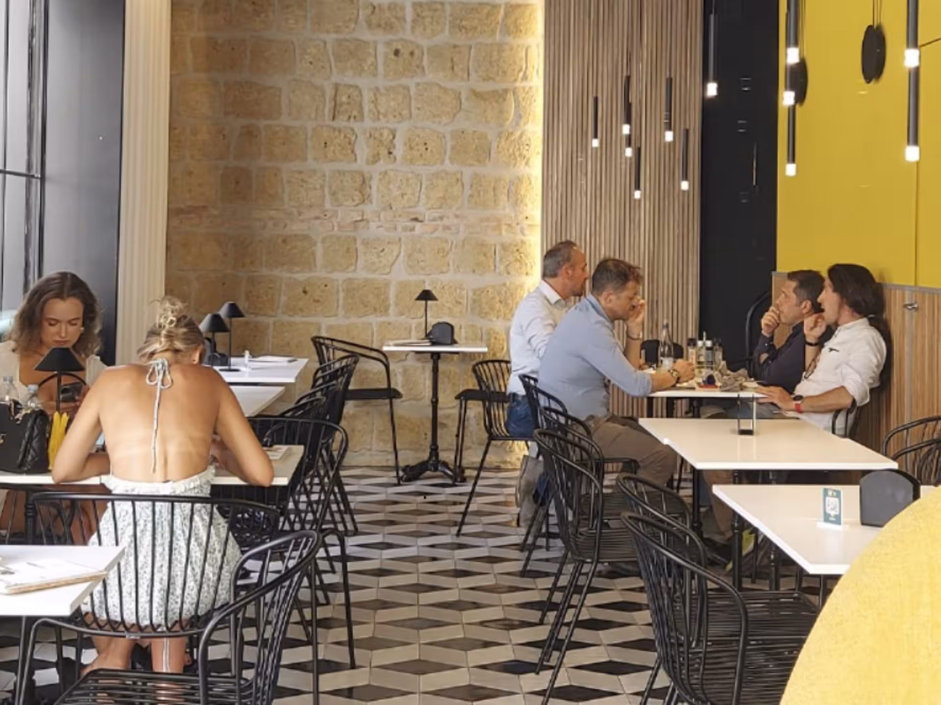 Cozy Neapolitan café setting with patrons enjoying a coffee tasting experience.