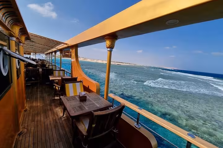 Nefertari Cruise Marsa Alam deck seating overlooking Red Sea reefs, with lunch or dinner and hotel pickup