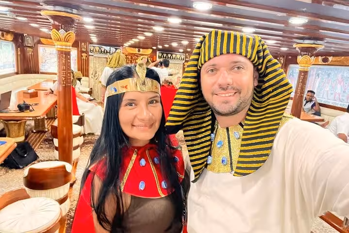 Couple in pharaoh outfits on Nefertari snorkeling cruise from Makadi, Red Sea boat tour with hotel pickup