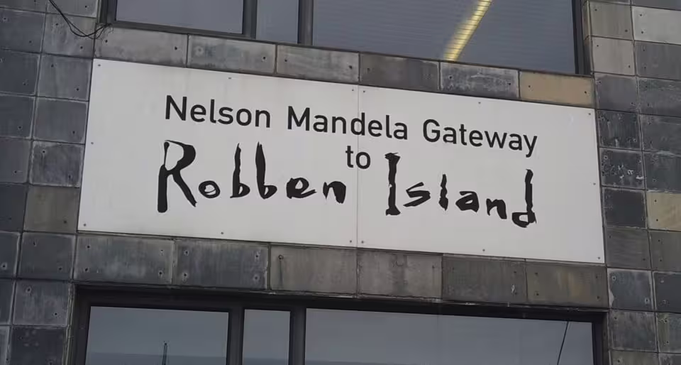 Entrance sign at Nelson Mandela Gateway to Robben Island, starting point for ferry tours with hotel transfer included.