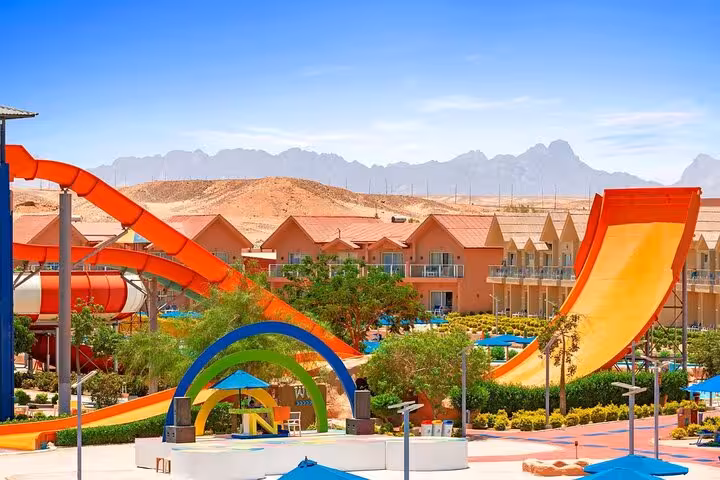 Colorful high-speed slides at Neverland Aqua Park from Hurghada with hotel transfers and lunch included