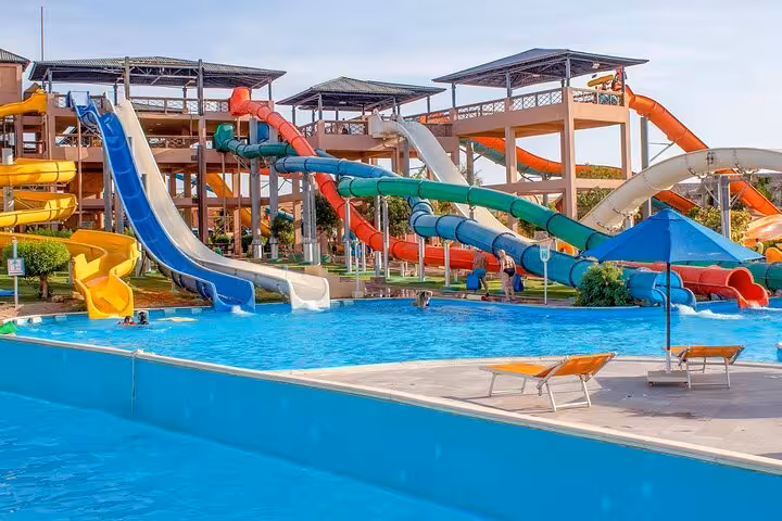 Multi-lane water slides and splash pool at Neverland Aqua Park Hurghada day trip with lunch and transfers