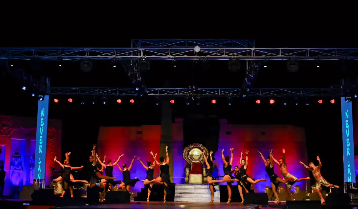 Neverland Show Sharm El Sheikh stage with acrobatic dancers and Egyptian-themed set under colorful lights
