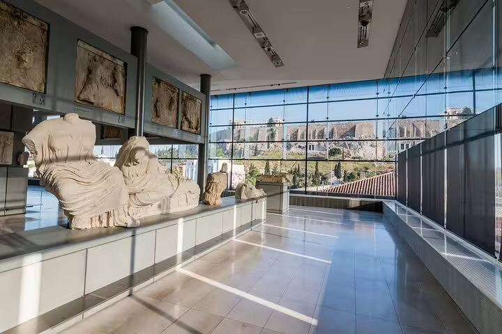 New Acropolis Museum gallery with ancient marble statues and panoramic Acropolis view on Athens walking tour