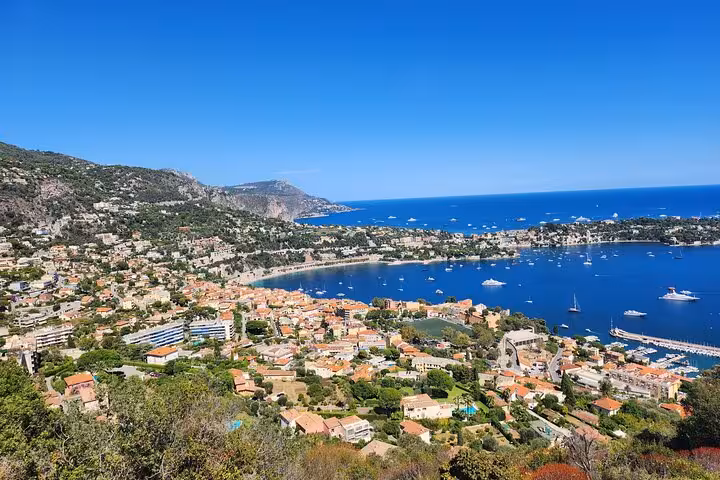 Stunning aerial view of Nice, France, showcasing vibrant buildings and a sparkling Mediterranean coastline.
