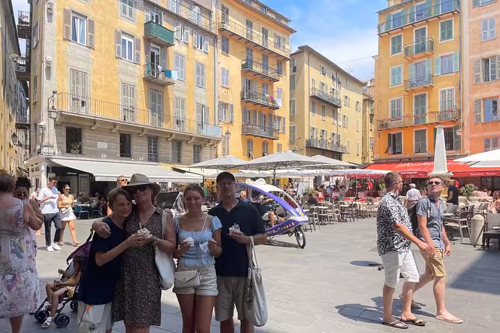 Travelers enjoying Nice Old Town square and outdoor cafés, part of a private day trip to Eze village and Monaco