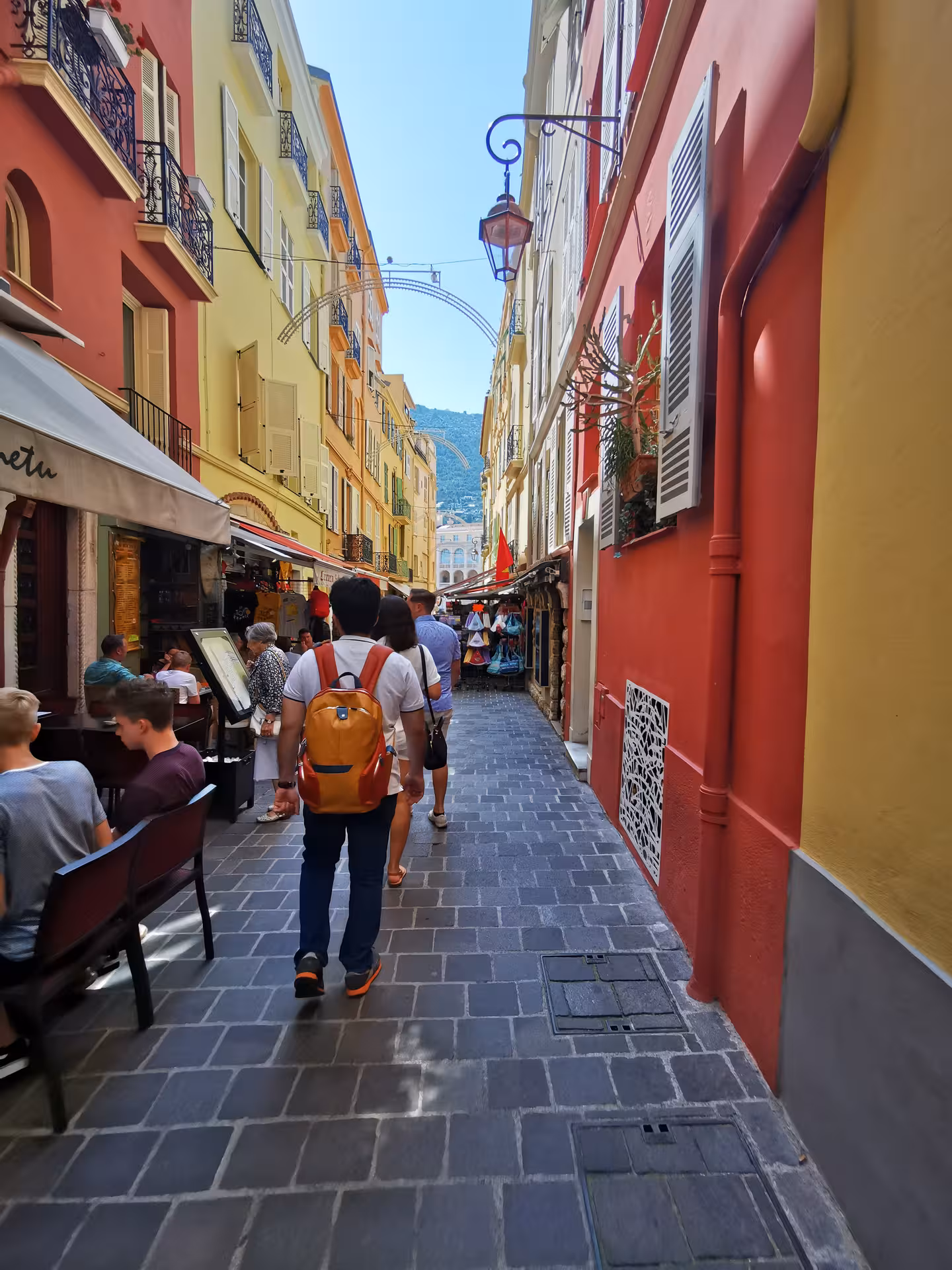 Colorful street in Nice old town with cafés and shoppers on Marseille shore excursion private day trip to Nice, Eze and Monaco