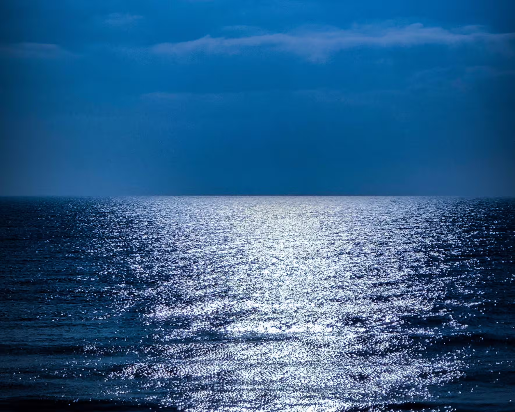 Ultra-bright sea, large body of water illuminated as if it were silver paper