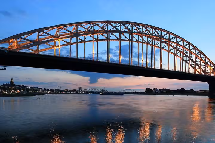 Evening view of Nijmegen Waalbrug bridge, destination for Amsterdam or Schiphol Airport private transfer