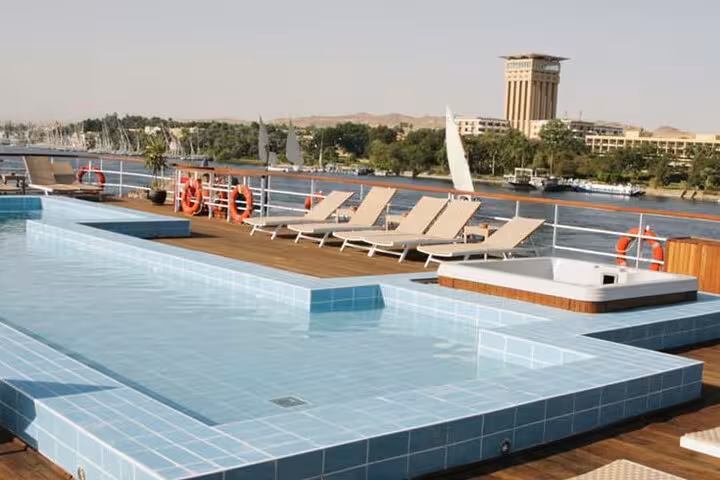 Rooftop pool deck on Nile cruise ship from Aswan to Luxor, 6 day tour with domestic flight and sun loungers