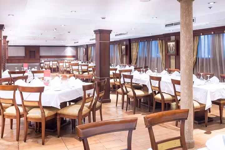 Elegant Nile cruise dining room on 4-day Aswan to Luxor itinerary with Abu Simbel and hot air balloon