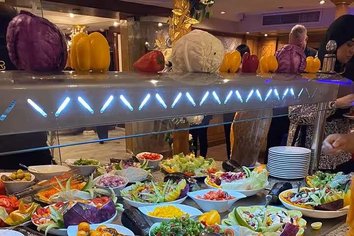 Colorful salad bar and carved vegetables on Nile cruise dining during 8-day Egypt tour Cairo Luxor Aswan Abu Simbel