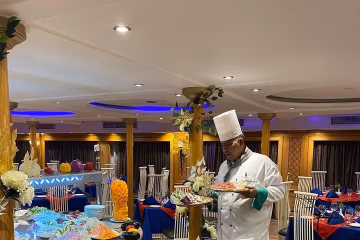 Chef serving dinner on a Nile cruise, part of 8-day Egypt tour from Cairo to Aswan, Luxor and Abu Simbel