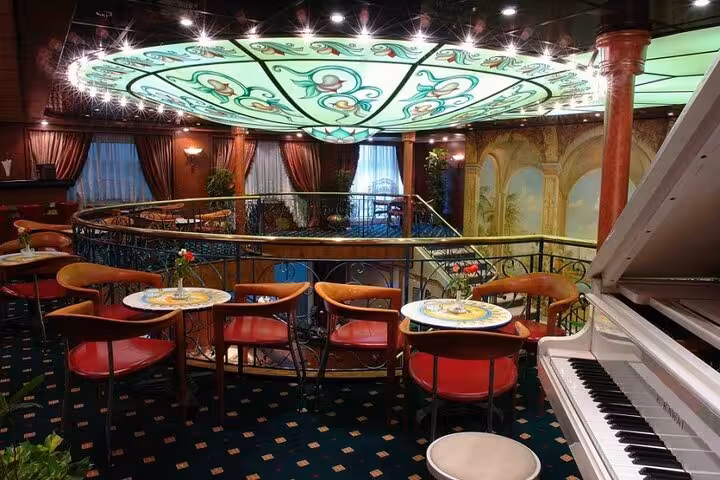Elegant Nile cruise lounge with sofas and stage lighting for 5-day Luxor to Aswan Egyptian Treasures cruise
