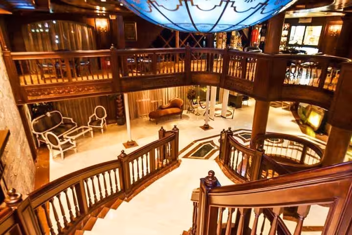 Elegant cruise ship atrium with grand staircase, Nile cruise comfort on 8-day Egypt tour to Aswan Luxor