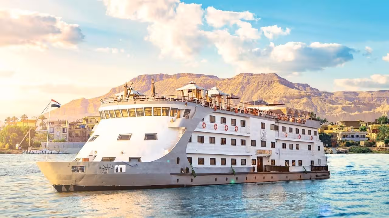 Nile cruise boat at sunset near Luxor, scenic sailing on the 15-day Egypt itinerary from Red Sea to temples