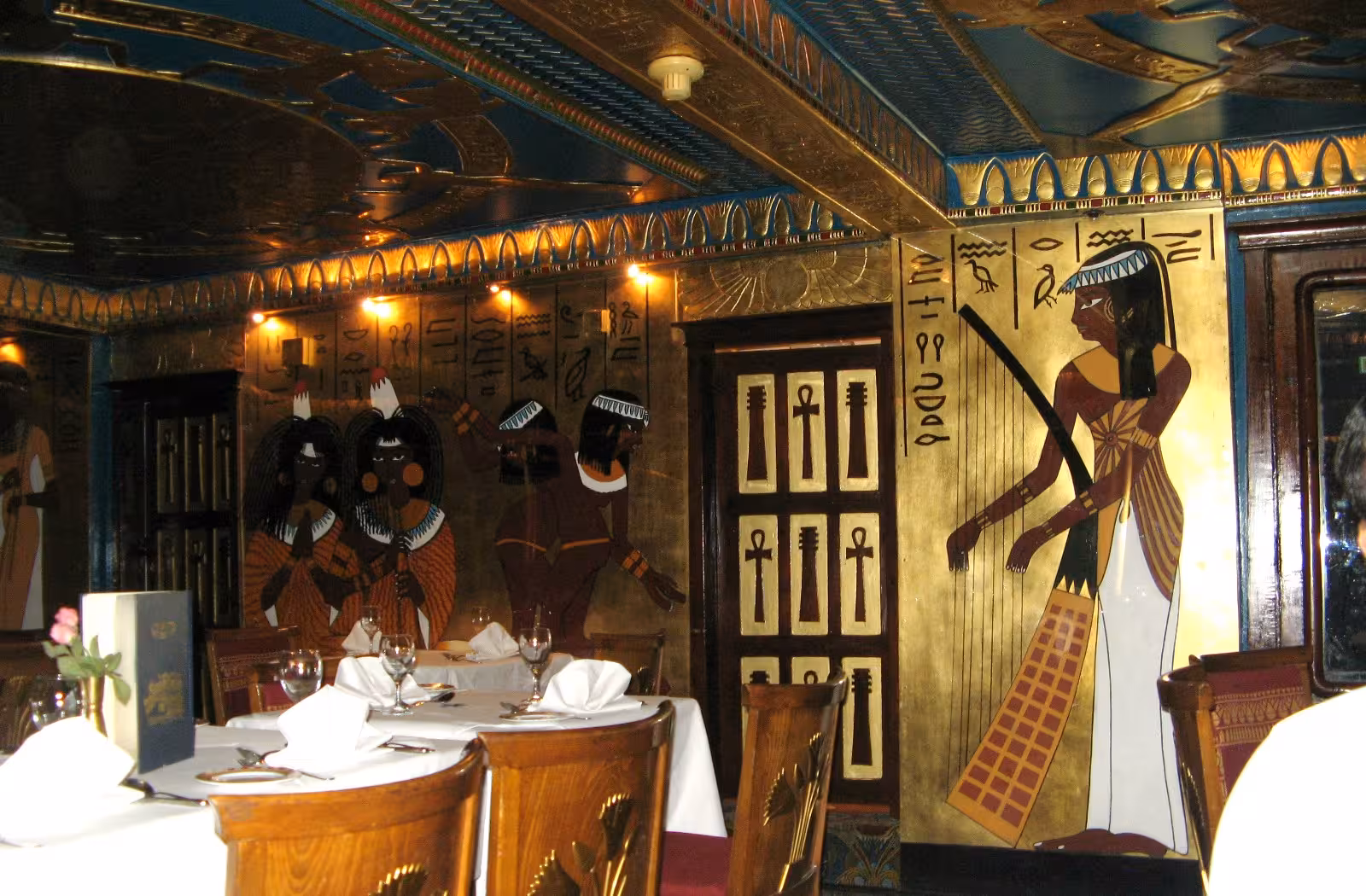 Elegant dining room with hieroglyphic murals on a luxury Nile cruise, Nile Pharaohs Cruising Booking experience