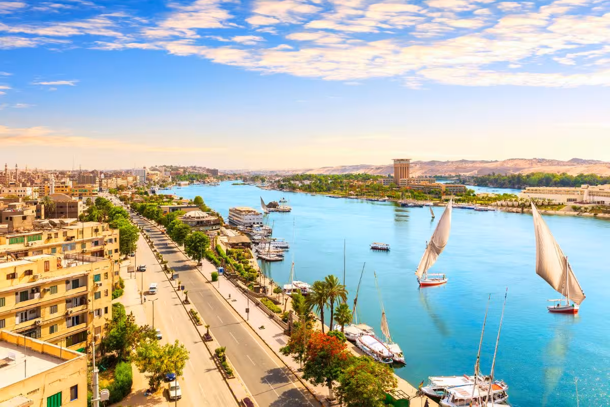Nile River in Cairo with felucca sailboats, scenic waterfront view on 15-day private Egypt tour from Marsa Alam
