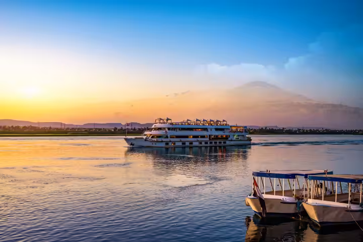 Nile River cruise ship at sunset in Luxor, highlight of an 11-day Discover Egypt budget tour with entrance fees