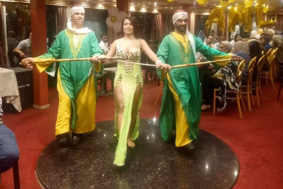 Belly dancer show on Nile River night dinner cruise in Cairo with live entertainment and festive dining