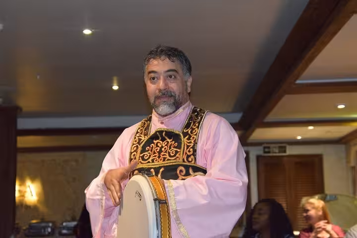 Traditional drummer entertaining guests on a Cairo Nile River dinner cruise with live music and folklore show
