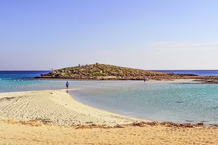 Nissi Beach lagoon and sandbar in Ayia Napa, crystal-clear waters on half-day Ayia Napa tour from Larnaca