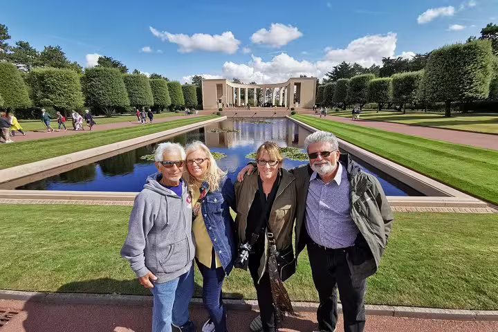 Visitors at Normandy American Cemetery reflecting pool, a key stop on private Normandy landing beaches day tour