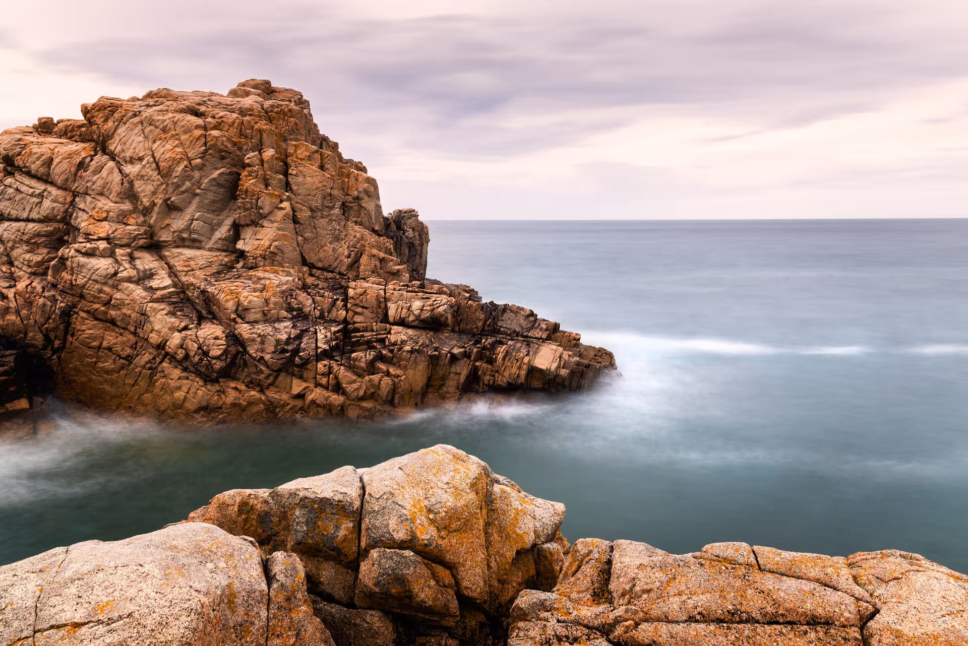 Rocky Normandy shoreline and calm sea, coastal viewpoint stop on Normandy D-Day VIP trip by private luxury van