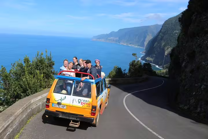 Tourists enjoy a scenic 4x4 ride along Madeira's stunning coastline on the Northeast meet the locals tour.