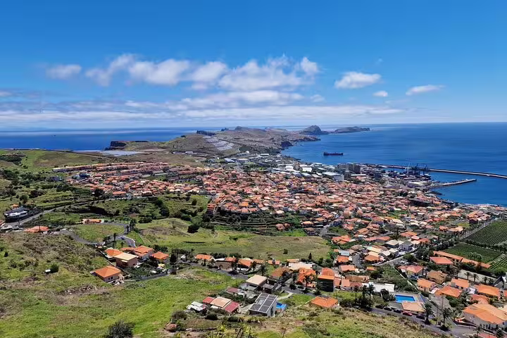 Panoramic view of Northeast Madeira's coastline featuring scenic landscapes, vibrant villages, and the Atlantic Ocean on a guided tour.