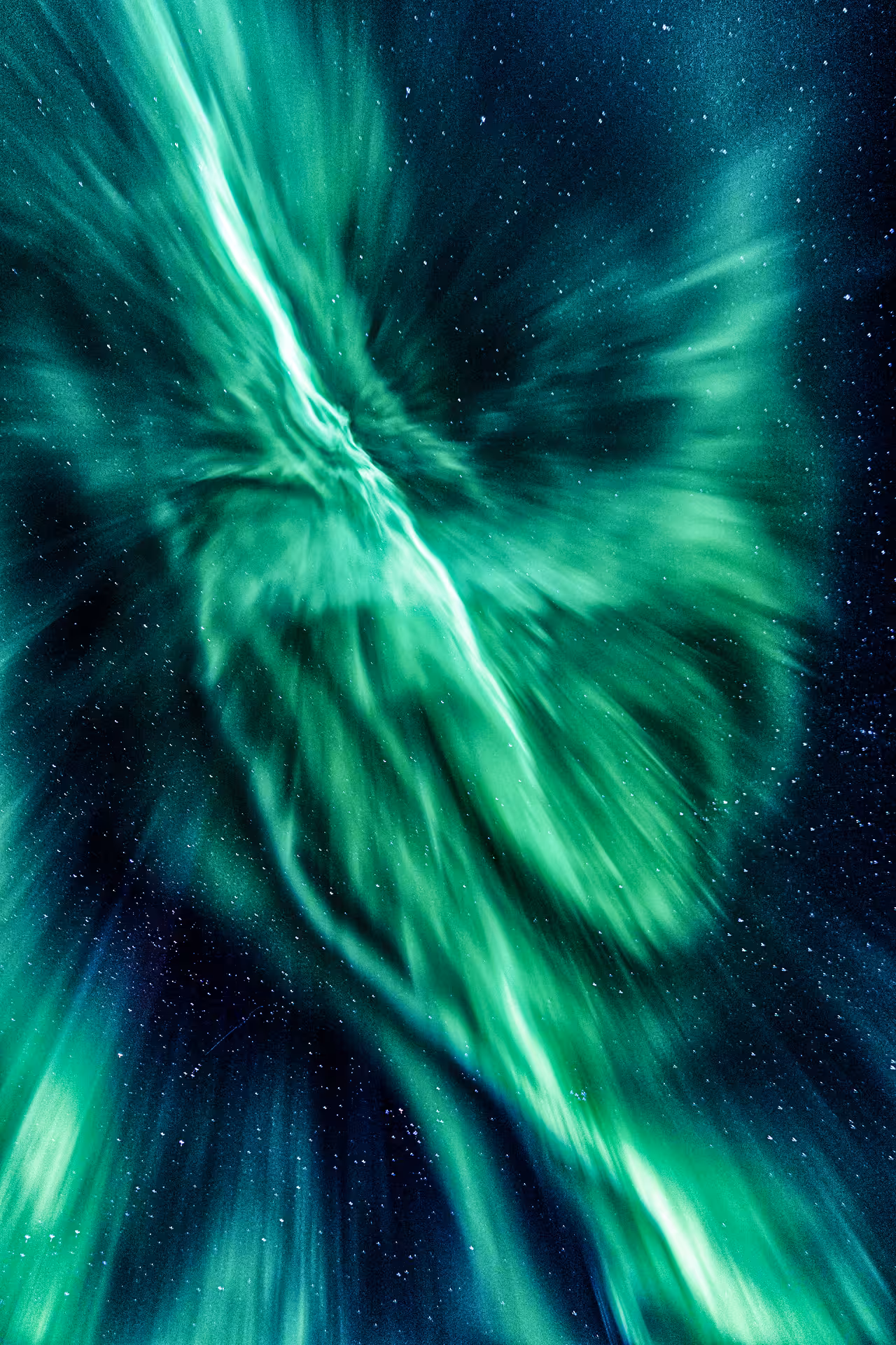 Vivid green aurora borealis swirling dramatically across a starry night sky in Iceland