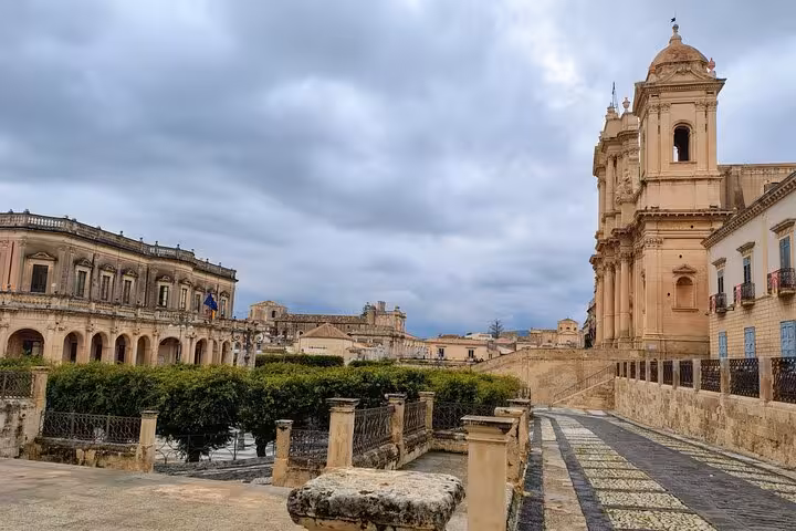 Picturesque view of Noto's baroque architecture and cobblestone pathways, perfect for a cultural walking tour.