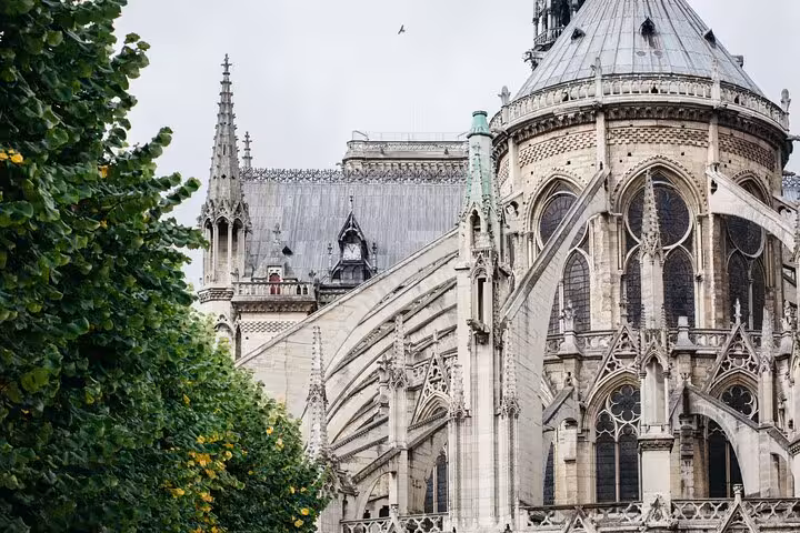 Notre-Dame Cathedral exterior with flying buttresses and apse, Paris, seen on a private guided historical tour