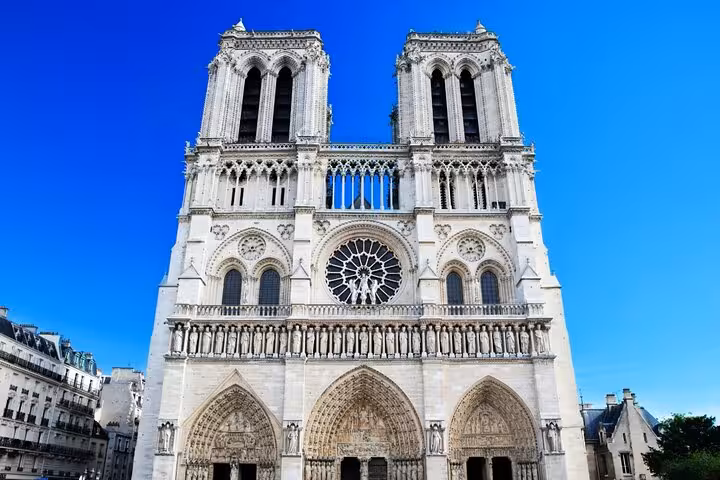 Notre-Dame Cathedral facade with twin towers and rose window on ND WALKING Tour 2 EN in Paris, France