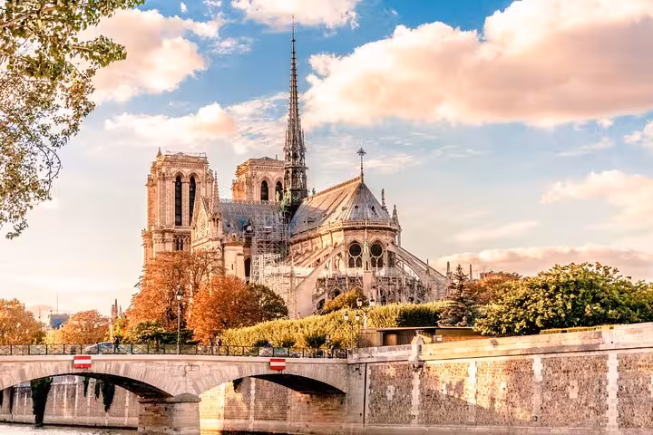 Notre-Dame Cathedral exterior from the Seine at sunset, highlight of ND Exterior & INTERIOR Tour SP Paris