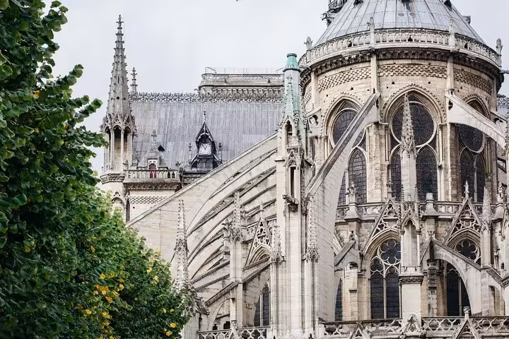 Notre Dame exterior flying buttresses and apse architecture, seen on a 90-minute semi-private Paris tour