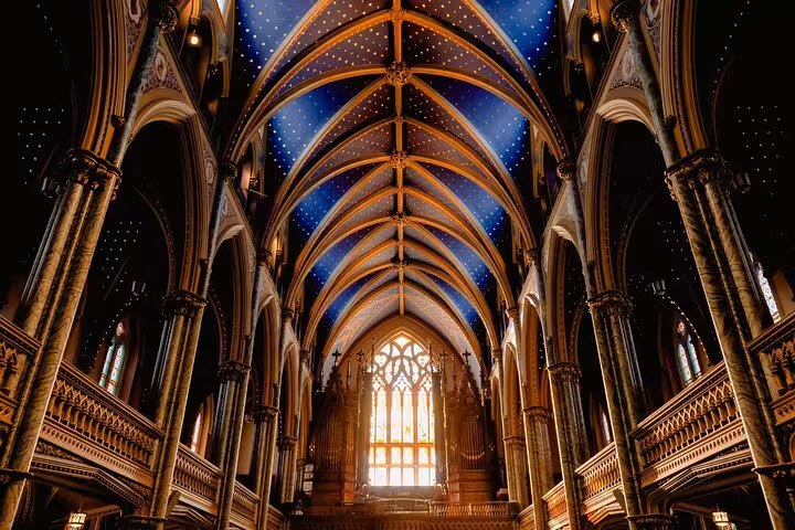 Gothic nave with blue starry ceiling inside Notre-Dame, Paris, on ND WALKING Tour 2 EN