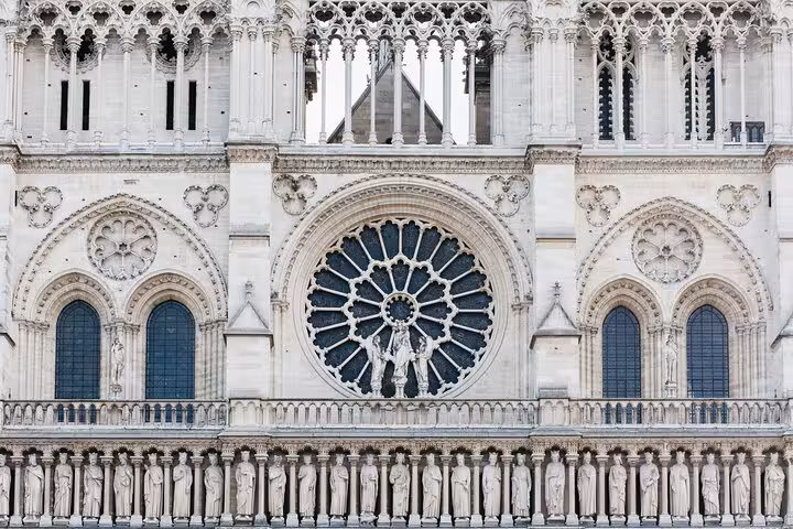 Notre Dame west facade rose window and Gallery of Kings, outdoor guided tour for kids in Paris France