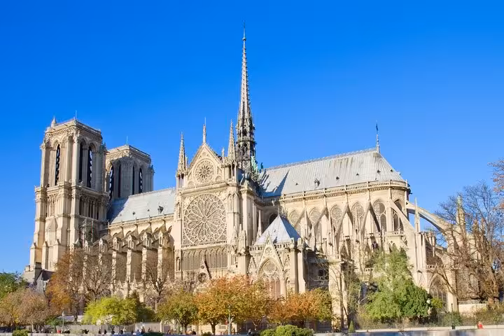 Wide view of Notre-Dame de Paris facade and spire, ideal stop on ND Exterior & Interior Tour EN