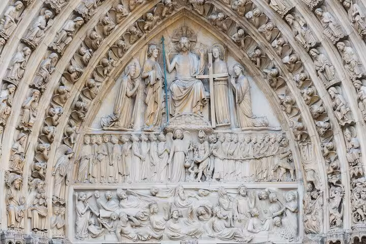 Close-up of Notre-Dame portal carvings and statues, perfect for a kid-friendly outside guided tour in Paris