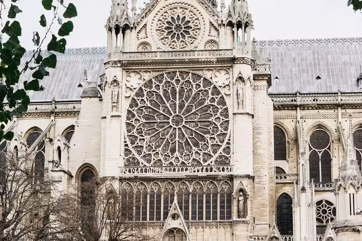 Notre Dame exterior facade with giant rose window, highlight of a family-friendly kids guided walking tour