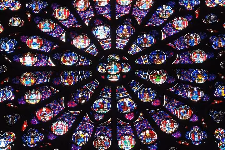 Vibrant medieval rose window stained glass at Notre Dame Cathedral Paris Gothic architecture walking tour