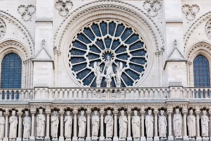 Close-up of Notre-Dame Cathedral west facade rose window and kings gallery on a 90-minute semi-private tour