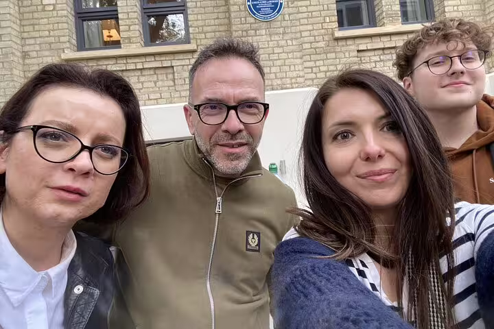 Group of four people taking a selfie on a Notting Hill walking tour in London